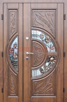Уличная дверь в цвете Итальянский орех с виноритом и ковкой со стеклом ДВТ-147 в Наро-Фоминске